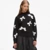 Exklusiver Pullover mit Schleife Exklusiver Pullover mit Schleife