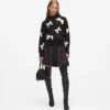 Exklusiver Pullover mit Schleife Exklusiver Pullover mit Schleife