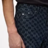 Jeans mit durchgehendem Monogramm Jeans mit durchgehendem Monogramm