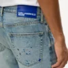 Tapered Jeans mit Farbspritzern Tapered Jeans mit Farbspritzern