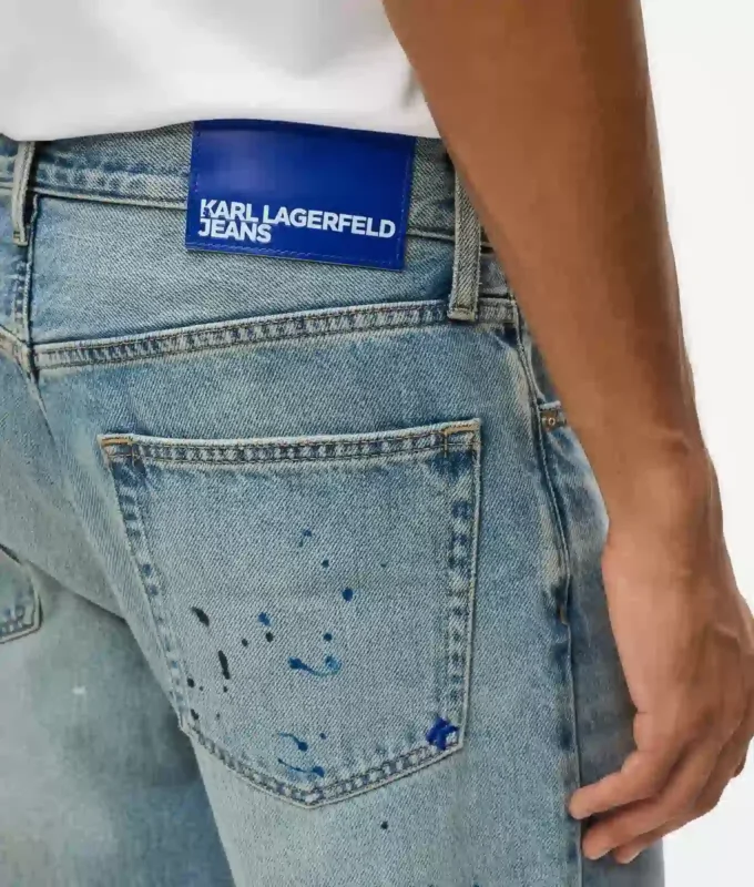 Tapered Jeans mit Farbspritzern Tapered Jeans mit Farbspritzern