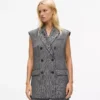 Tweedweste mit Paillettenrevers Tweedweste mit Paillettenrevers